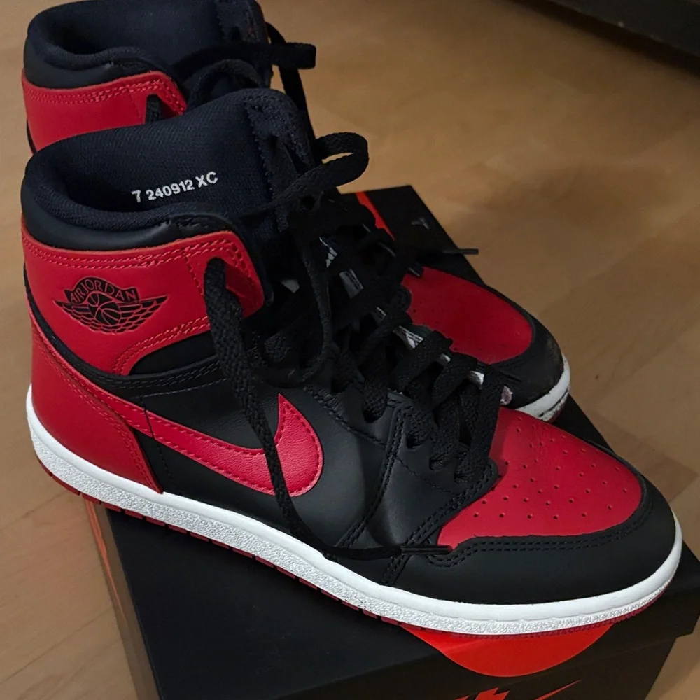 Nike Air Jordan 1 High in Black and Red